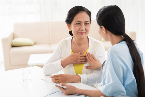 heart disease consultation between doctor and senior woman