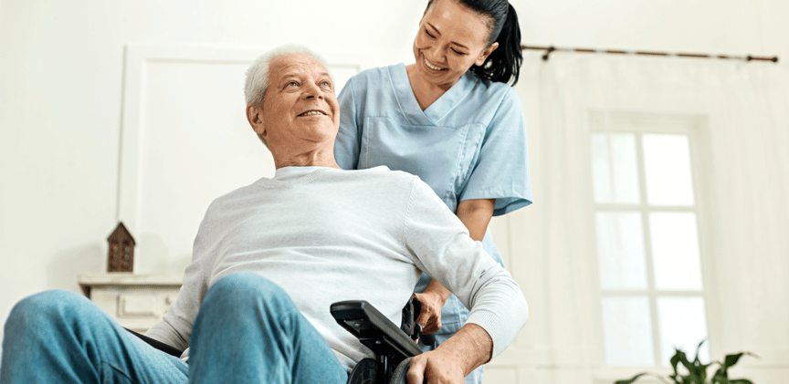 nurse with man with spinal injury in wheelchair