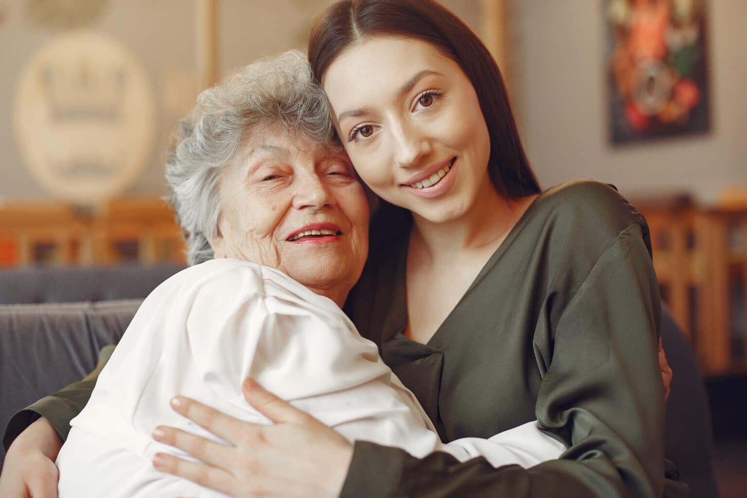 A woman embracing her grandmother after a stem cell therapy session